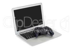 Joystick and laptop on white background