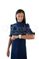 Female executive looking at her smartwatch