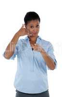 Businesswoman pretending to talk on a cell phone