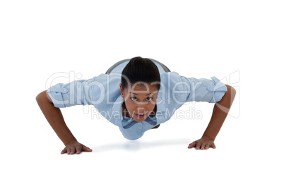 Businesswoman performing push ups