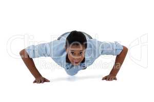 Businesswoman performing push ups