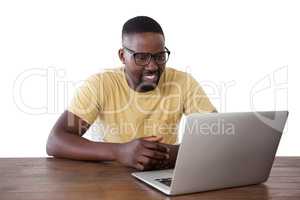 Man using laptop against white background