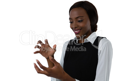 Close up of happy woman gesturing against white background