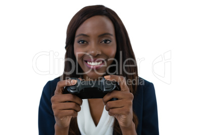 Close up of smiling businesswoman playing video game
