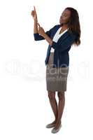 Full length of businesswoman gesturing during presentation