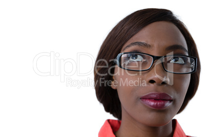 Close up up of woman with eyeglasses looking up