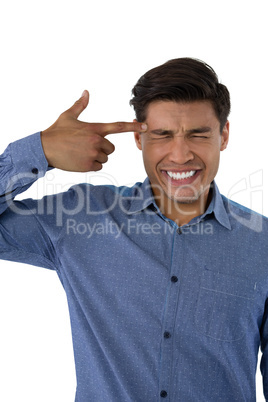 Close up of businessman with suicide gesture