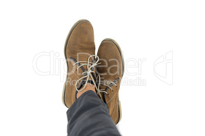 Low section of man wearing shoes