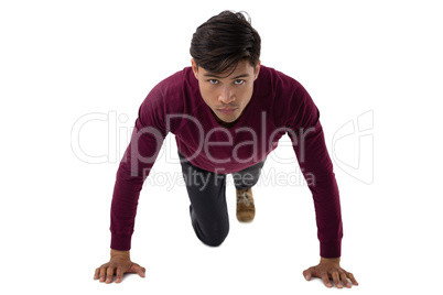 Portrait of businessman doing push ups