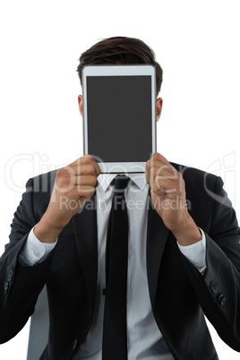Close up of businessman holding tablet computer