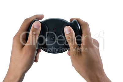Cropped image of man holding controller