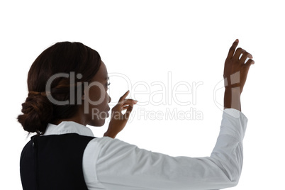 Side view of businesswoman using interface