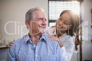Smiling therapist and male patient looking at each other