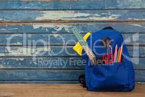 Schoolbag on wooden background