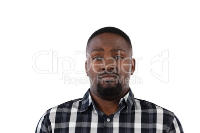 Confused man against white background