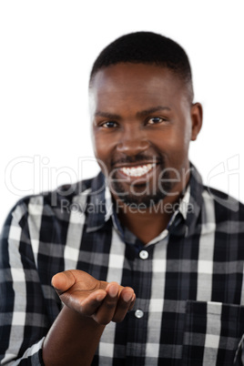 Happy man gesturing against white background