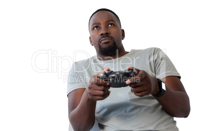 Man playing video game against white background