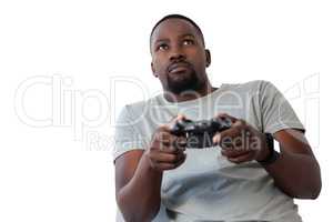 Man playing video game against white background