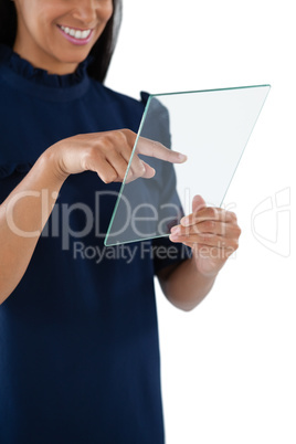 Female executive using a glass digital tablet