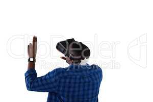 Man gesturing while using virtual reality headset