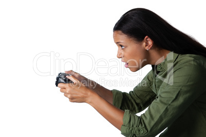 Woman playing video game against white background