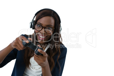Woman wearing eyeglasses and headphones while playing video game