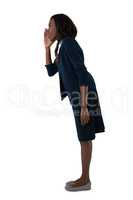 Side view of businesswoman shouting