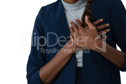 Mid section of woman suffering from chest pain