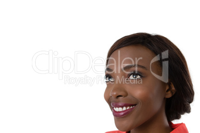 Close up of happy thoughtful woman looking up