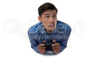 Young businessman playing video game