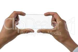 Cropped image of hand holding transparent interface