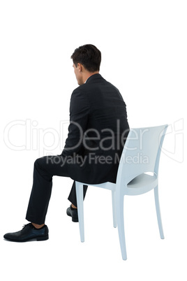 Rear view of businessman sitting on chair