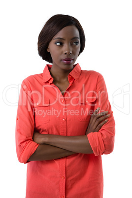 Young woman with arms crossed looking away