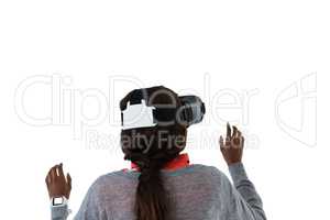 Young woman gesturing while using vr glasses