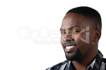 Happy man standing against white background