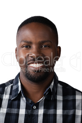 Smiling man standing against white background