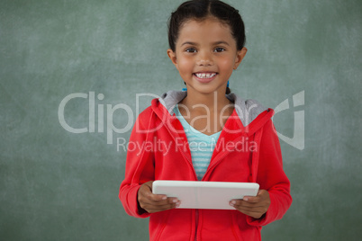 Young girl holding digital tablet