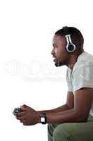 Man playing video game against white background