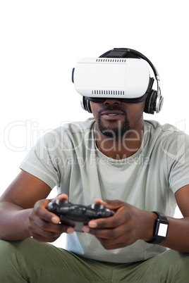 Man using virtual reality headset and playing video game