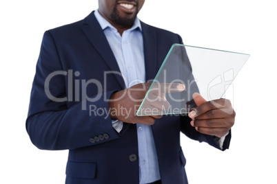 Businessman using a glass digital tablet