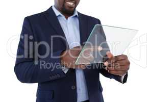 Businessman using a glass digital tablet