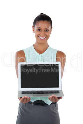 Happy businesswoman holding a laptop