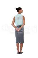 Businesswoman standing against white background