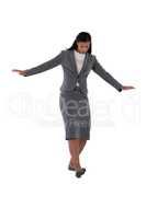 Businesswoman balancing while walking