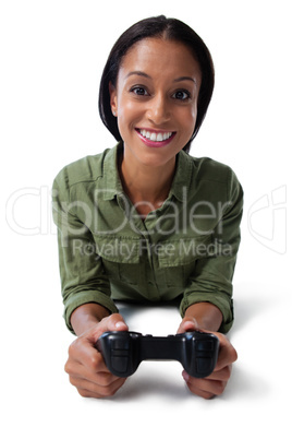 Woman playing video game against white background