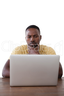 Man using laptop against white background