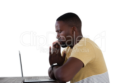 Man using laptop against white background