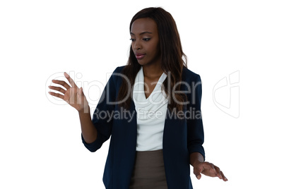 Businesswoman touching invisible interface