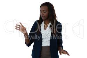 Businesswoman touching invisible interface
