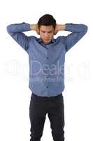 Businessman with hands covering ears